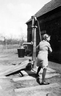 Ilse Schrock at the pump