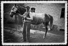Franciszek Uzarek in front of the barn