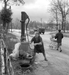 Stanisława Lis at the hand pump