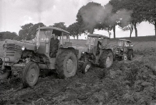 Pulling out a tractor that is stuck in sandy soil